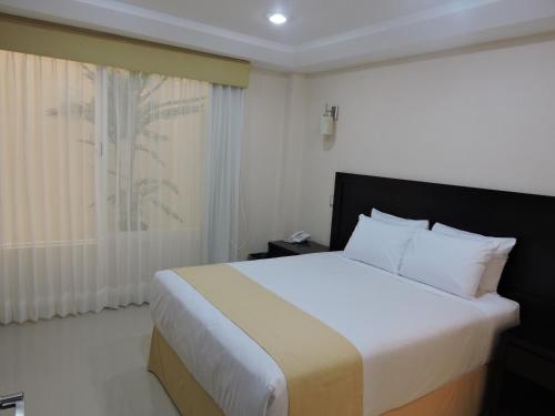 Giường trong phòng chung tại Casa Jasave Hotel