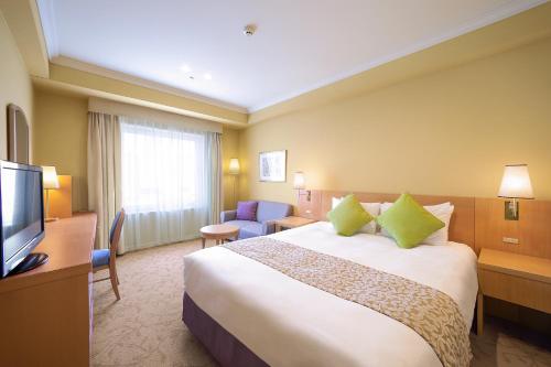 Postelja oz. postelje v sobi nastanitve Namba Oriental Hotel