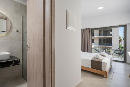 a hotel room with a bed and a bathroom at Kallistefan in Kissamos