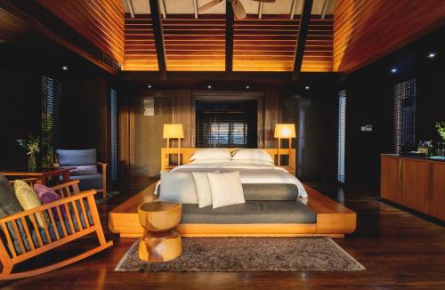 a bedroom with a large bed in a room at The Tubkaak Krabi Boutique Resort in Tab Kaek Beach