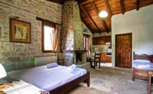 Posteľ alebo postele v izbe v ubytovaní Stone Village Hotel Apartments
