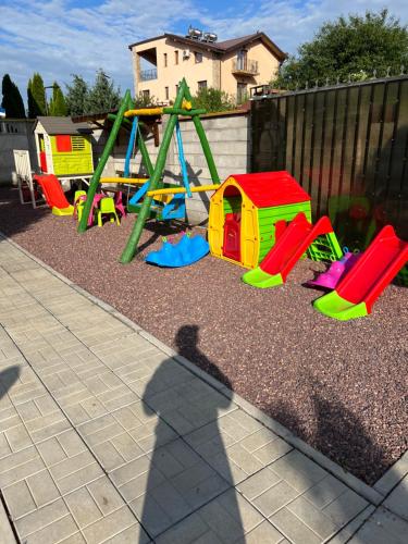 a shadow of a person taking a picture of a playground at Casa Florenta in Venus