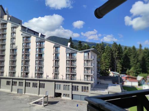 a large building with a skate park in front of it at IGLIKA 2 SNOWY NIGHT V 31 in Borovets