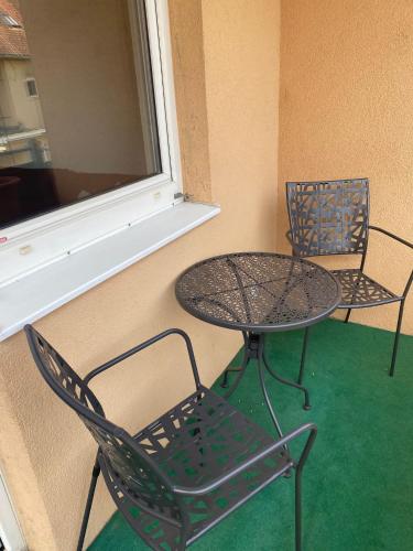 two chairs and a table next to a window at Gamlitz - RaStra Top 7 in Gamlitz