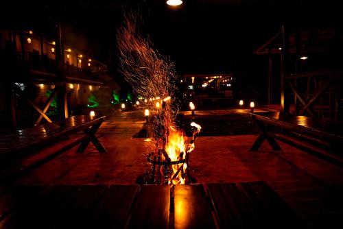 a fire fountain with candles in a street at night at Stephen's Legacy in Vattavada
