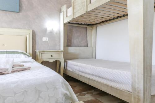a bedroom with two beds and a bunk bed at Blue And Blue City in Ugento