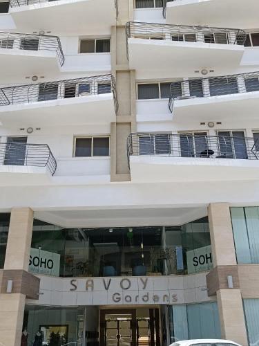 a building with the sony okayos club sign on it at Centrally located and tastefully furnished one bedroom apartment CKNI1-1 in Il-Gżira