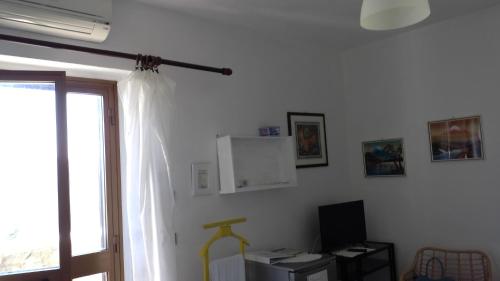a room with a window and a desk with a computer at Cinque Terre Tra Il Filo Di Arianna in Riccò del Golfo di Spezia