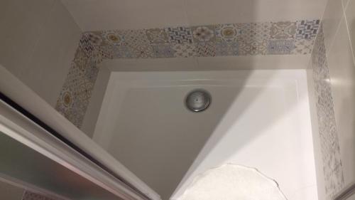 a shower with a silver button in a bathroom at Cinque Terre Tra Il Filo Di Arianna in Riccò del Golfo di Spezia
