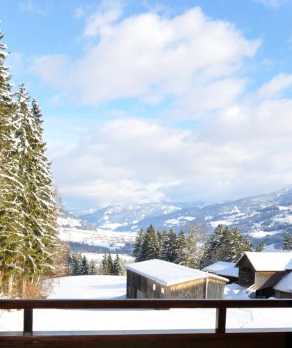a view from the balcony of a house in the snow at Haus Kocher in Haus im Ennstal