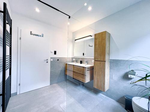 a bathroom with a sink and a shower at Appartement Chalet N° 156 Wagrain in Wagrain