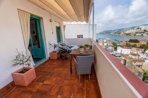 a balcony with a table and a view of the water at Hostal Boutique Olvido 22 Adults Only in Peñíscola