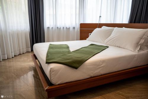 Postel nebo postele na pokoji v ubytování Casa Valcellina Hotel Ristorante