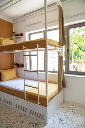 a bunk bed in a room with a window at BE BOLD HOSTEL in Antalya
