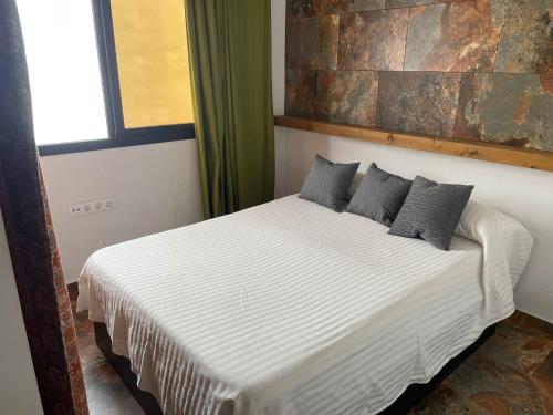 Ένα ή περισσότερα κρεβάτια σε δωμάτιο στο Casa Amelie