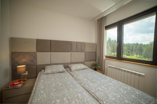 Tempat tidur dalam kamar di Vila Maša Zlatibor