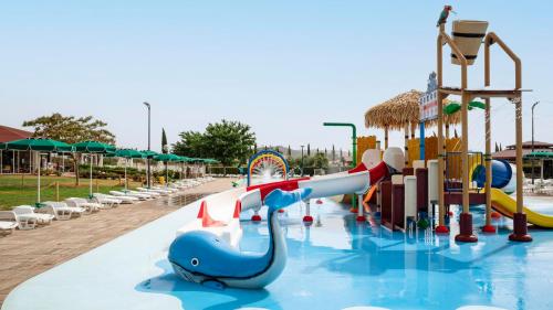 a water park with a water slide and a water playground at Casa in Maremma Tuscany Village in Scarlino