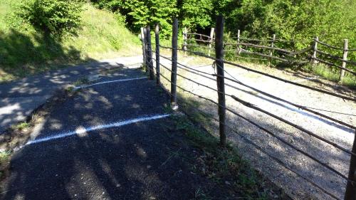 a road with a fence on the side of it at Cinque Terre Tra Il Filo Di Arianna in Riccò del Golfo di Spezia