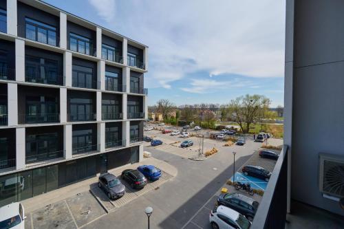 an aerial view of a parking lot in front of a building at Airport Studio Zarembowicza by Noclegi Renters in Wrocław