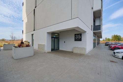 a building with a clock on the side of it at Airport Studio Zarembowicza by Noclegi Renters in Wrocław