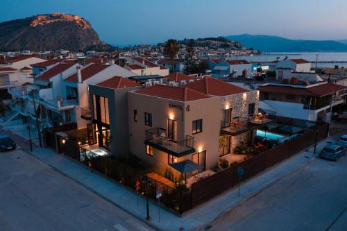 an aerial view of a city at night at Capital Luxury Suites in Nafplio