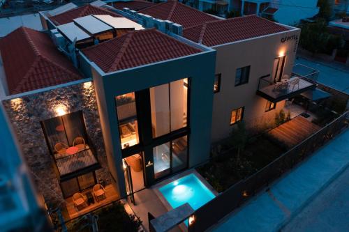 an aerial view of a house at night at Capital Luxury Suites in Nafplio