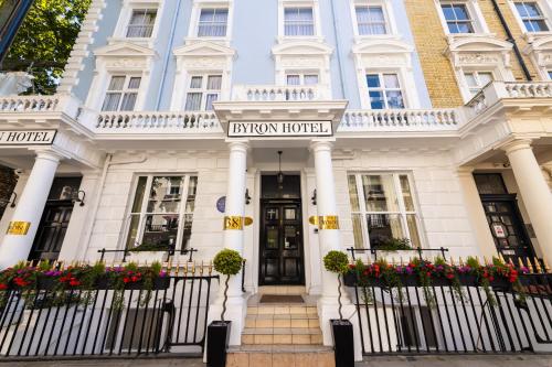 a white building with a sign that reads entry house at Byron Hotel in London