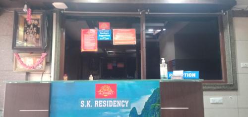 a bar in a building with signs on it at S K RESIDENCY in Bangalore