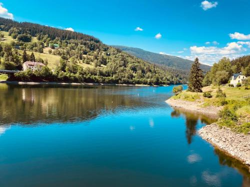 a view of a river with mountains in the background at Residence Grand - soukromý apartmán in Špindlerův Mlýn