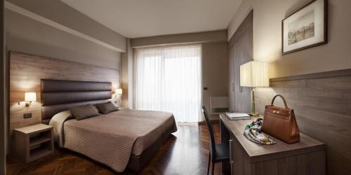 Katil atau katil-katil dalam bilik di Hotel San Giorgio