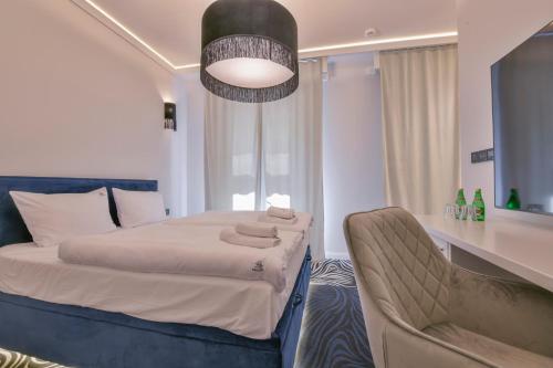 Ένα ή περισσότερα κρεβάτια σε δωμάτιο στο Fregata Kołobrzeg