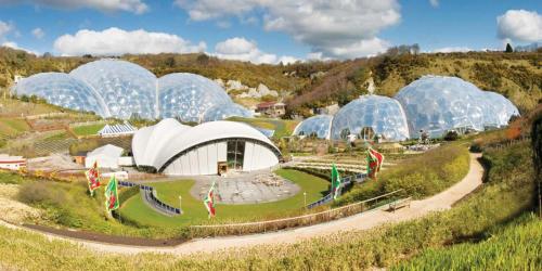 a group of domes in a field with a garden at Charlestown cottage, Woodburner, Gardens & Parking in Charlestown