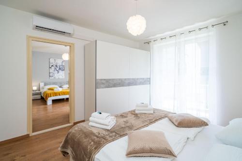 Ліжко або ліжка в номері Apartment Ding Dong