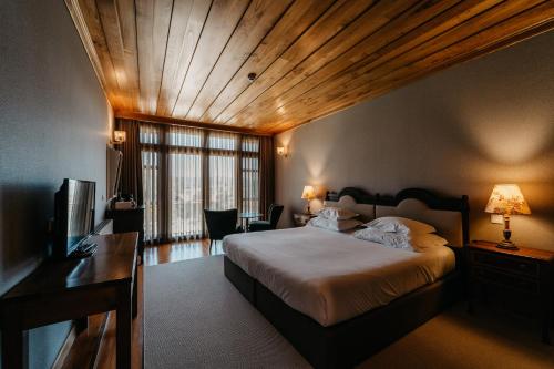En eller flere senge i et værelse på Casa Lata - Agroturismo e Enoturismo