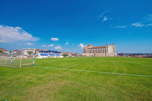 a soccer field in front of a building at Hotel Santa Maria in Obzor