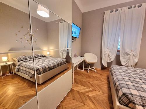 Ένα ή περισσότερα κρεβάτια σε δωμάτιο στο Residence Montanelli