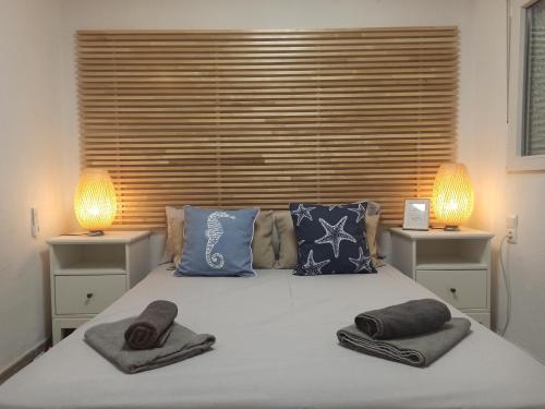 Posteľ alebo postele v izbe v ubytovaní BOIRA - Vivienda en urbanización a primera línea de playa