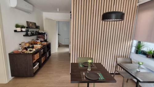 a living room with a table and a dining room at B&B Plitvice Lacus in Seliste Dreznicko