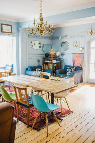 a dining room with a table and chairs at Cairn Bay Lodge in Bangor