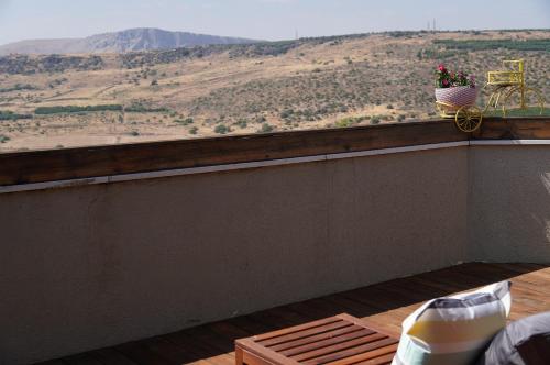 a balcony with a view of a mountain at Agama in Livnim