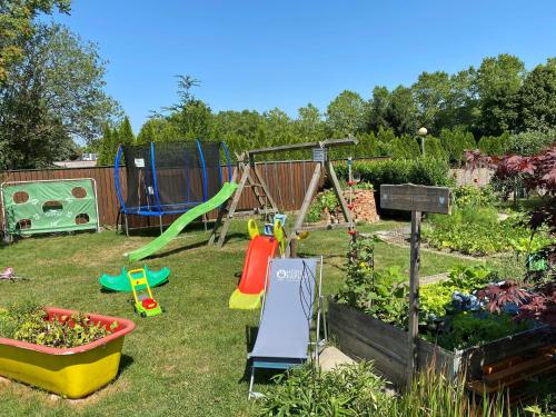 a garden with a playground and a play set at Hotel & Wirtshaus Hödl-Kaplan in Feldbach