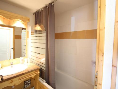 a bathroom with a sink and a shower at Studio Chamrousse, 1 pièce, 4 personnes - FR-1-340-243 in Chamrousse