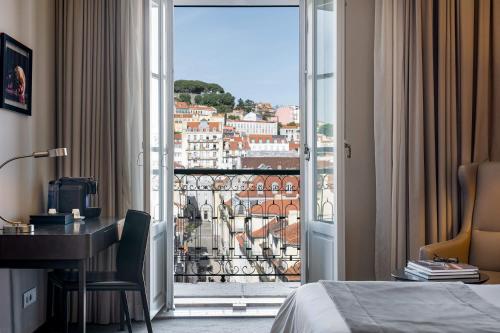 a hotel room with a view of a city at Hotel do Chiado in Lisbon
