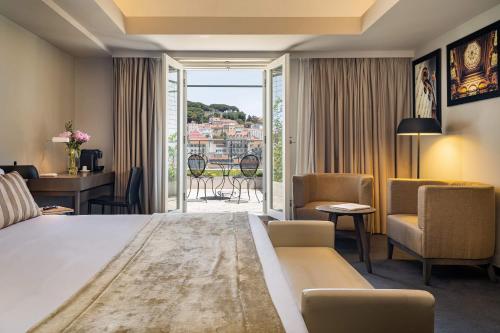 Cama ou camas em um quarto em Hotel do Chiado