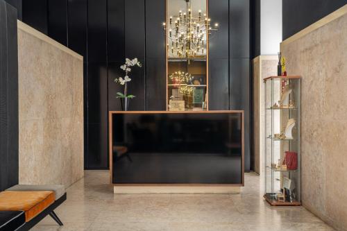 a living room with a flat screen tv at Hotel do Chiado in Lisbon