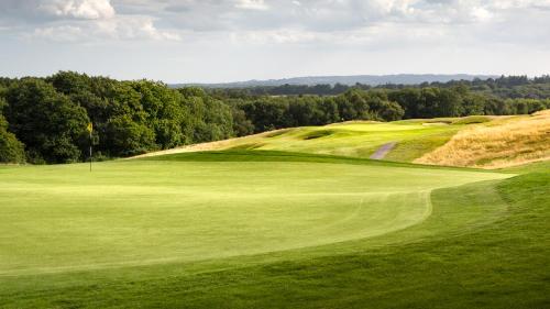 a view of a green golf course with a hazard sqor at Dale Hill Hotel in Ticehurst