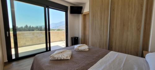 Tempat tidur dalam kamar di Splendid Villas and Family Resort