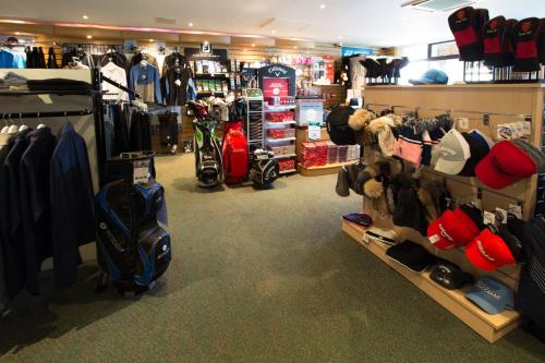 a store filled with lots of clothes and helmets at Dale Hill Hotel in Ticehurst