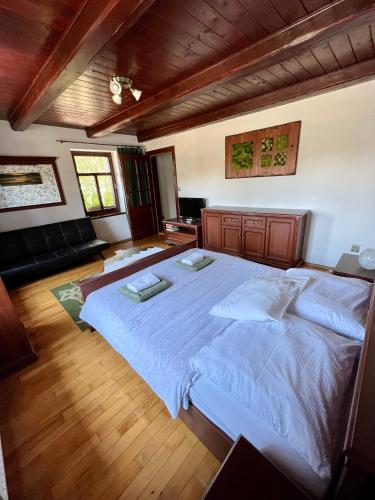 a bedroom with a large bed in a room at Chalupa MATEJKO in Liptovský Mikuláš