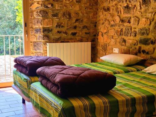Ліжко або ліжка в номері Casa en paraje natural único 25 pax